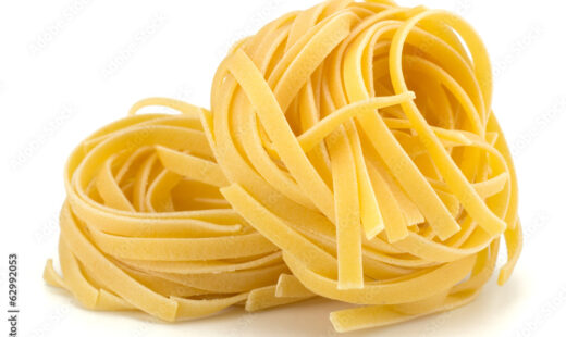 Italian egg pasta nest isolated on white background